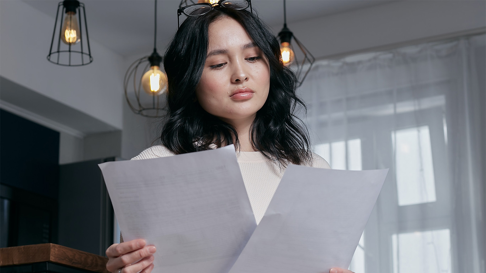 Young woman looking at her paperwork 