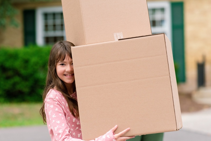 Young girl moving into her family's first home 