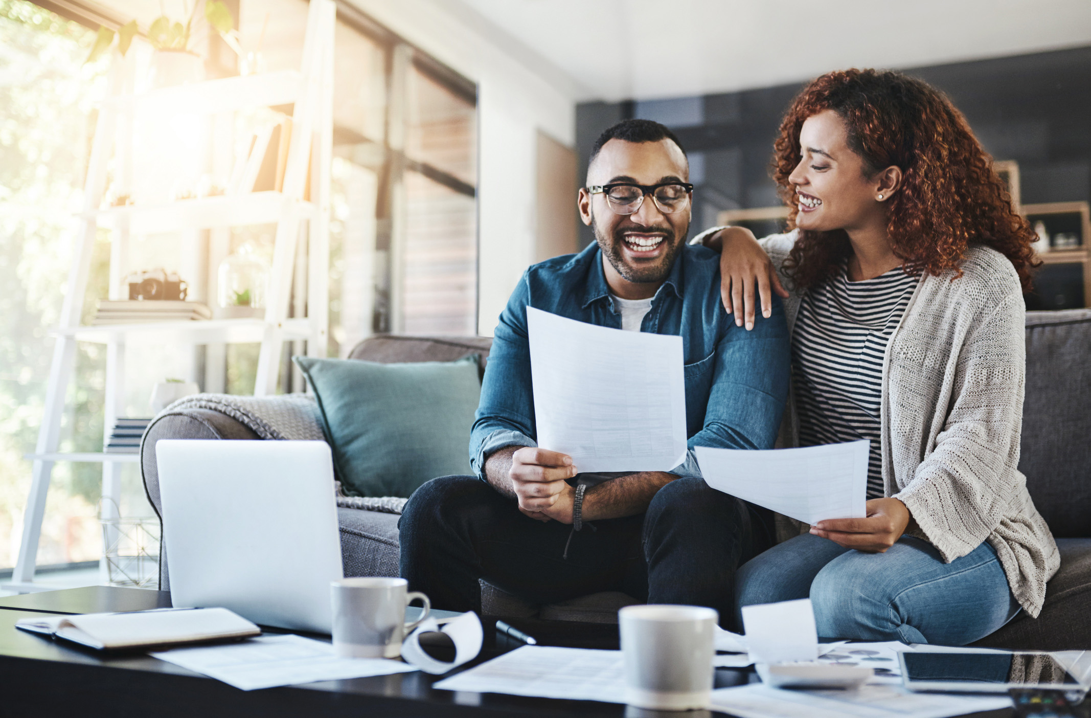 Young couple reviewing their financial score 